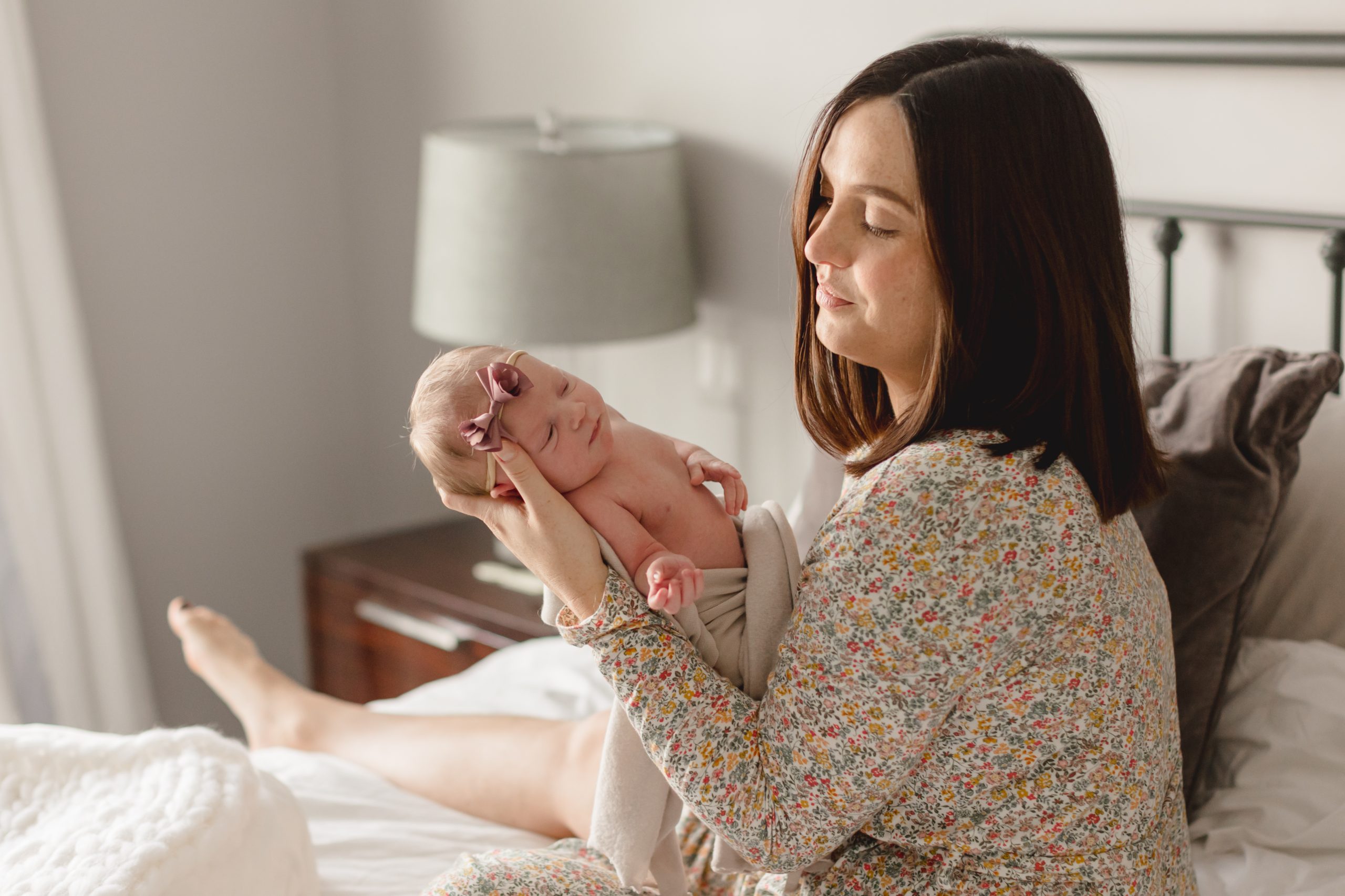mother and newborn on bed